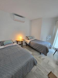 En eller flere senge i et værelse på Casa 13