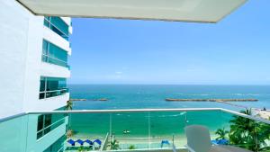 a view of the ocean from the balcony of a building at Magico Apartamento Frente al Mar 4 Habitaciones BM63 in Coveñas
