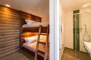 En eller flere senger på et rom på Villa Pascal
