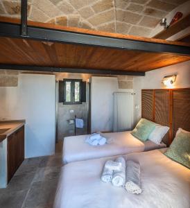 En eller flere senger på et rom på Villa Pascal