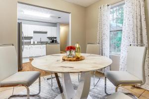 a kitchen and dining room with a table and chairs at Walk to Dtwn Woodstock Modern Home with Patio! in Woodstock