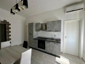Η κουζίνα ή μικρή κουζίνα στο Olbia Terranova - Apartments +5 φωτογραφίες