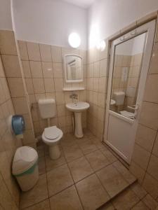 a bathroom with a toilet and a sink at Casa Luca 2 in Vama Veche +88 photos