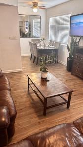a living room with a table and a dining room at 3 Bedrooms Florida Sunshine in Pompano Beach