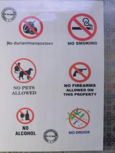 a sign that says no smoking and no fires allowed on this property at Homestay Marina in Lumut +8 photos