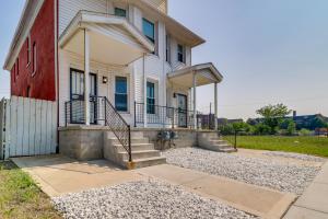 a house with stairs and a stoop in front of it at 4 Mi to Dtwn Detroit Townhome Near North End in Detroit