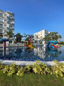 a water park with a playground in the water at Zeleny Santorini in Negombo