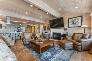 a living room with a couch and a fireplace at Big Blue Views Walk 2 Lake in Tahoe Vista