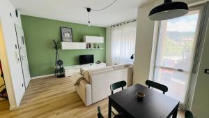 Телевизор и/или развлекательный центр в La Dimora di Borgo