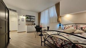 Ένα ή περισσότερα κρεβάτια σε δωμάτιο στο Talenti Suites Rome Casa Vacanze