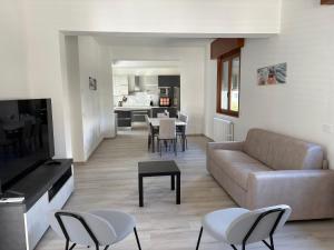 a living room with a couch and a table at Tominettihome in Verbania