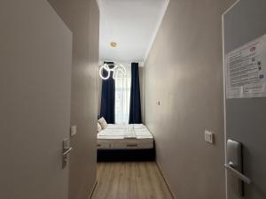 Cama o camas de una habitación en Hotel Odeon Apartments and Rooms I Self Check In