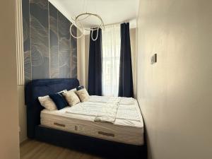Cama o camas de una habitación en Hotel Odeon Apartments and Rooms I Self Check In