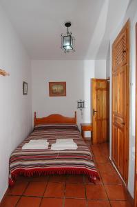 Postel nebo postele na pokoji v ubytování Apartamentos Turísticos Rural Los Tinaos