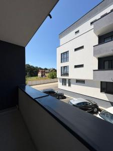 a view of a building with cars parked in a parking lot at Studio Felix Relax MAO 13&14 in Baile Felix