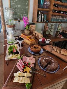 a table topped with lots of different types of food at Pousada Portal do Céu in Domingos Martins +43 photos
