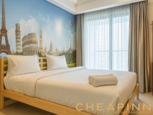 Postel nebo postele na pokoji v ubytování Apartemen Gold Coast PIK Sea View by Cheapinn + 39 fotografií