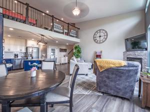 a dining room and living room with a table and chairs at Black Hills Barndo-Hot Tub & Massage Chair in Hermosa +27 photos