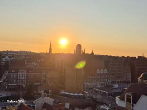 Pohľad na východ alebo západ slnka z apartmánu alebo blízkeho okolia