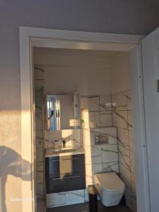 Kúpeľňa v ubytovaní Apartament Długie Ogrody 2 pokojowy