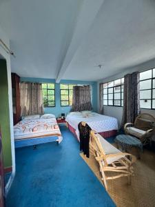 Ένα ή περισσότερα κρεβάτια σε δωμάτιο στο Casa Kukulcán #1