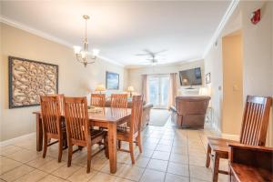 a dining room and living room with a table and chairs at Mountain View Condo 3307 in Pigeon Forge