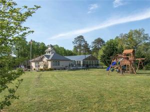 a yard with a house and a playground at Mountain View Condo 3307 in Pigeon Forge
