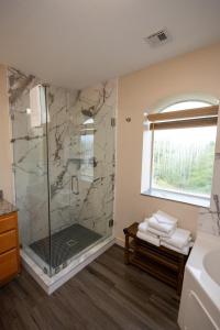 a bathroom with a shower with a glass door at Mountain View Condo 1501 in Pigeon Forge