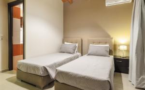 Кровать или кровати в номере Eden Villas