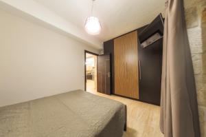 Кровать или кровати в номере Eden Villas