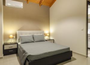 Кровать или кровати в номере Eden Villas