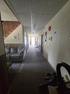 a hallway with a couch in a room at Coal Branch Hotel & Restaurant in Coalspur