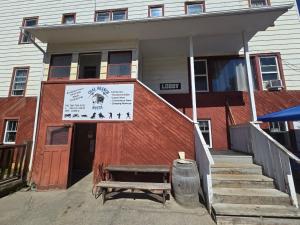 a building with a bench in front of it at Coal Branch Hotel & Restaurant in Coalspur