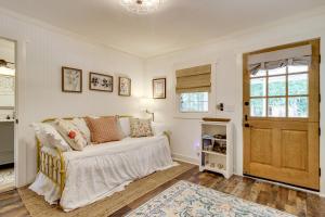 a living room with a couch and a window at Shepard Cottage Near Wilmington and Wedding Venue in Burgaw