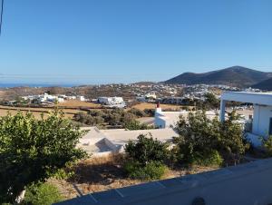 a view of a city from the roof of a building at Θέα - Thea in Artemonas