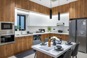 Η κουζίνα ή μικρή κουζίνα στο Yasmin Homes - Luxury Apartments