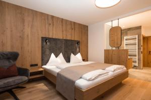 Postel nebo postele na pokoji v ubytování Berghotel Alpenklang