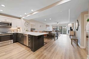a large kitchen and dining room with a dining table at St James Place 216 in Beaver Creek +29 photos