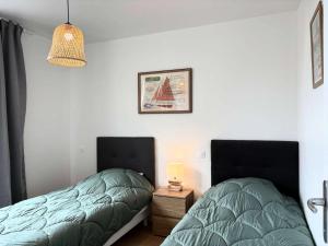 Postel nebo postele na pokoji v ubytování Résidence L09-tregastel - Vacances à quelques pas de la mer et des commerces MAE-4871