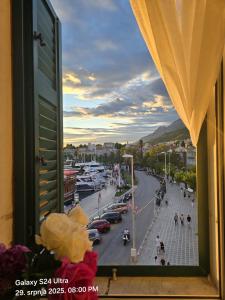 a view of a city street from a window at VELE with parking and sea view in Makarska