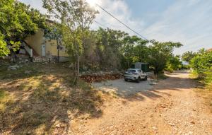 a car parked on the side of a dirt road at Vista Mare in Vinjerac