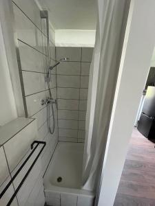 a bathroom with a shower with a toilet and a sink at Auszeit in Lügde