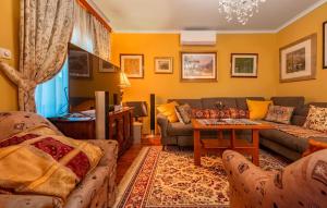 a living room with a couch and a table at Vista Mare in Vinjerac +19 photos