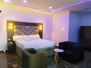 Voodi või voodid majutusasutuse Basil Hotel and Suites toas