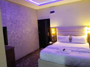 Voodi või voodid majutusasutuse Basil Hotel and Suites toas