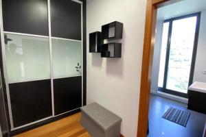 a bathroom with a shower and a toilet and a window at Sal e Pimenta House - A Wellbeing Retreat in Machico