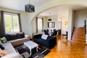 a living room with a couch and a table at Viva Village in Gaula