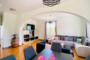 a living room with a couch and a table at Viva Village in Gaula +17 photos