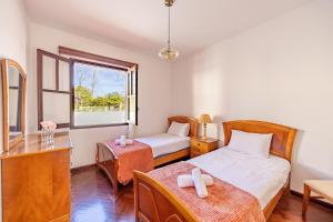 Ένα ή περισσότερα κρεβάτια σε δωμάτιο στο Silva Retreat Villa