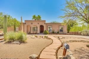a brick house with a walkway in front of a yard at Bear Canyon Casa - Tucson Home Base with Mtn Views in Tucson